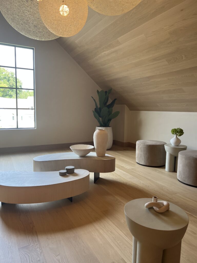 Curved coffee tables in attic lounge