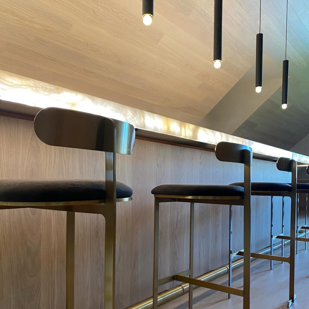 Modern bar seating in attic lounge